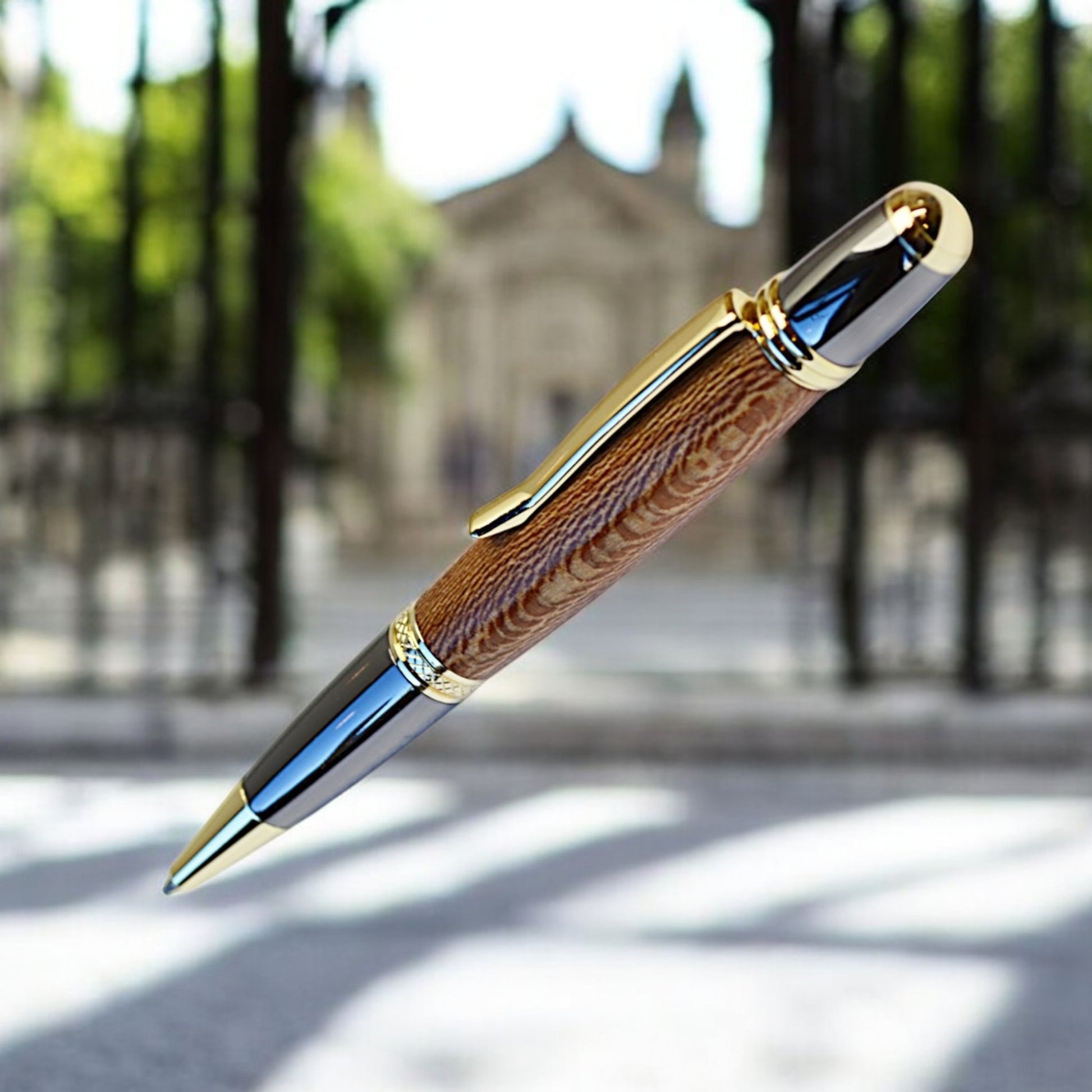 Handmade Irish ballpoint pen crafted from English Plane wood with Gold and Black Titanium trim – inspired by the Book of Kells"