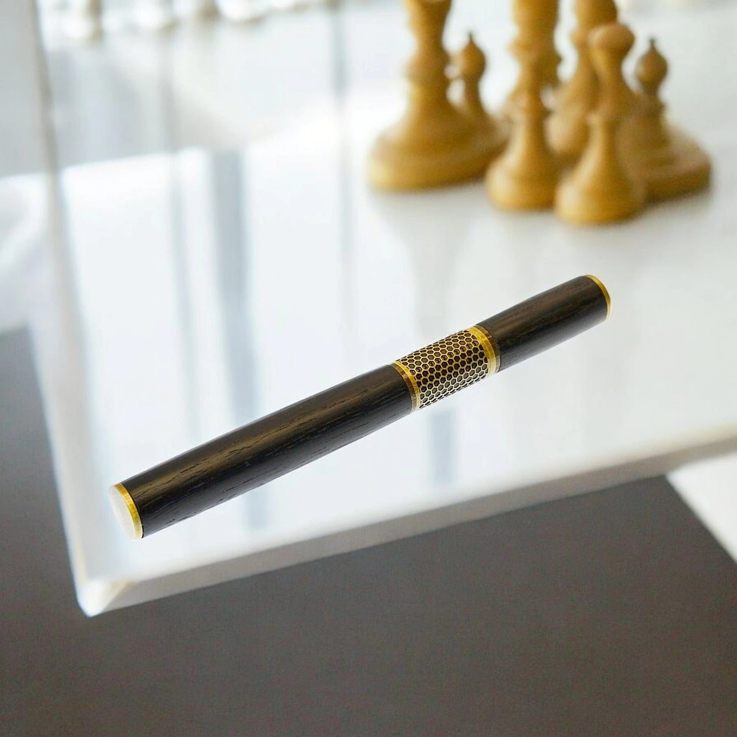 Handmade rollerball pen crafted in Ireland from ancient Irish bog oak, showcasing rich dark grain and traditional craftsmanship.