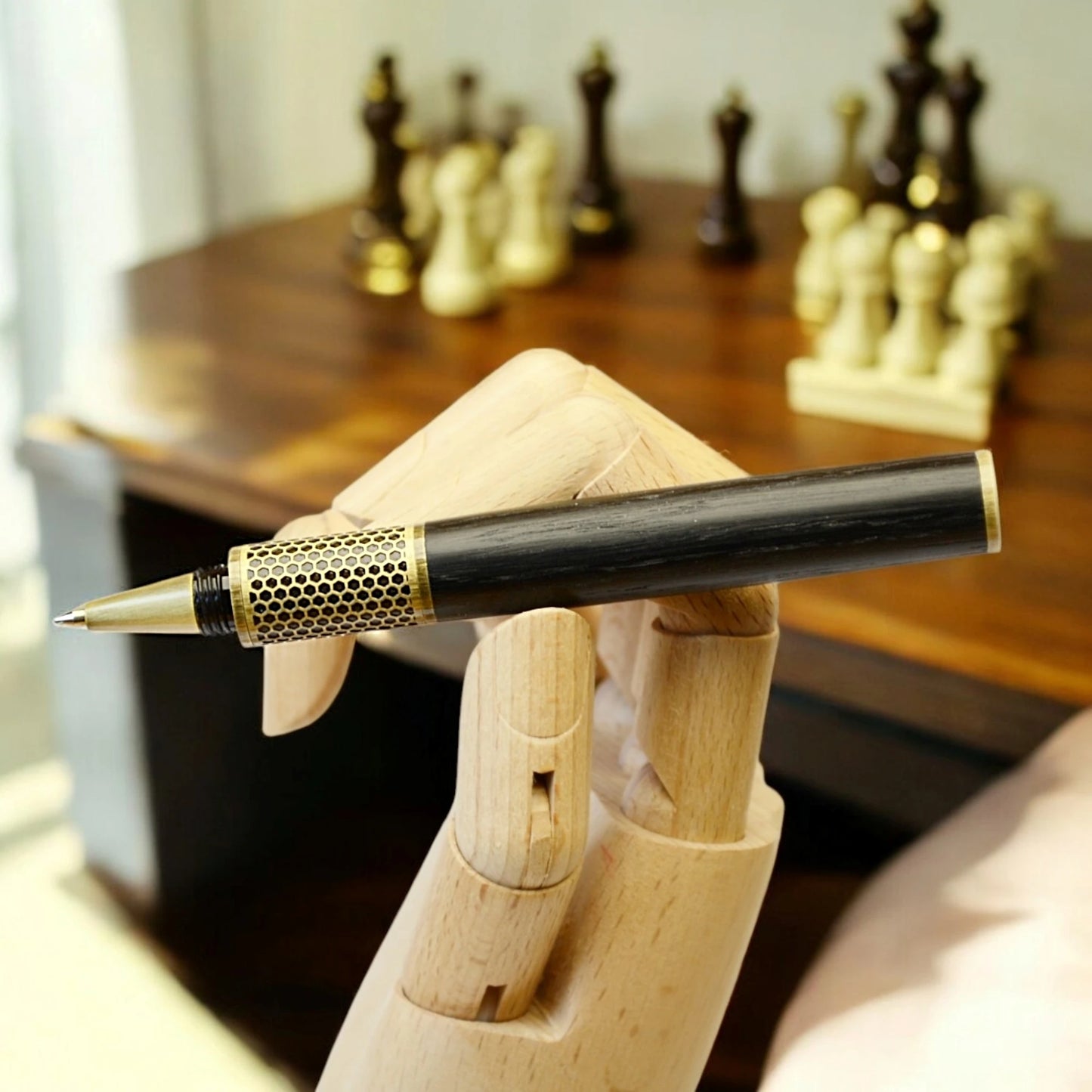 Handmade rollerball pen crafted in Ireland from ancient Irish bog oak, showcasing rich dark grain and traditional craftsmanship.