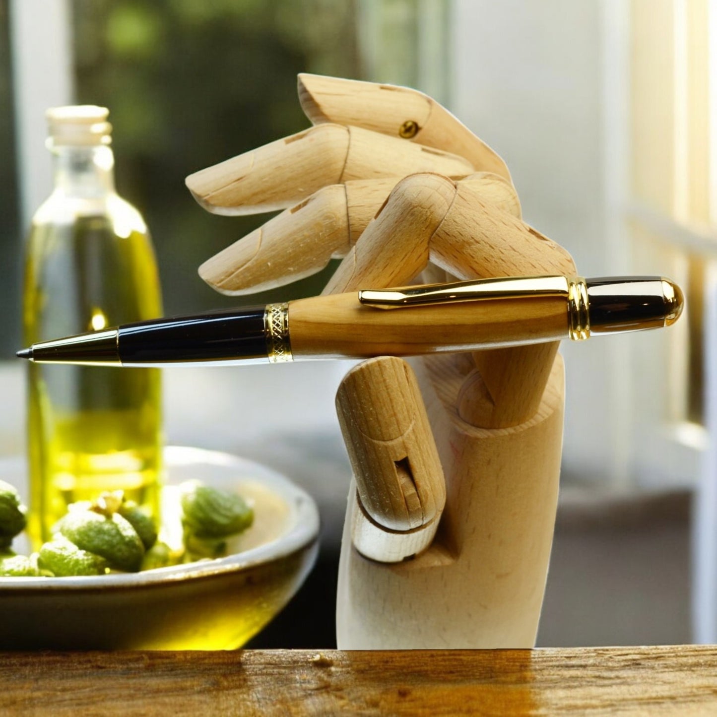Close-up view of golden olive wood grain and swirling patterns on Irish handmade ballpoint pen