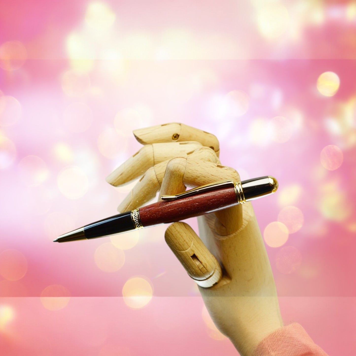 Hand-turned Purple Heart Wood ballpoint pen with gold and black titanium trim, handmade in Ireland and presented in a luxury gift case