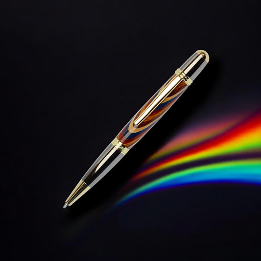 Handcrafted Rainbow Wood ballpoint pen with gold and black titanium trim, handmade in Ireland and presented in a luxury gift box