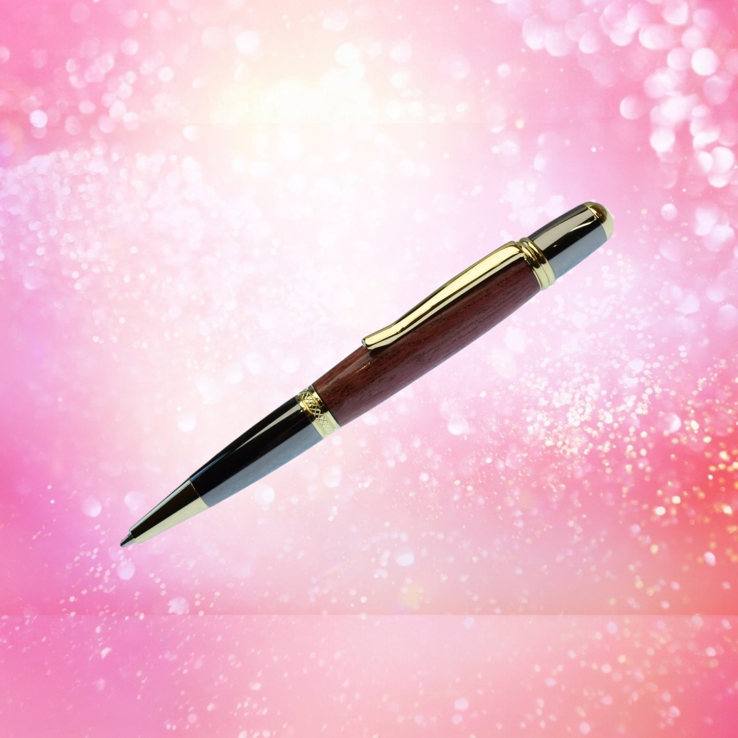 Hand-turned Purple Heart Wood ballpoint pen with gold and black titanium trim, handmade in Ireland and presented in a luxury gift case