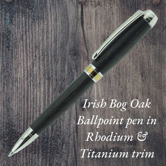 Handmade Woodland Ballpoint Pen crafted from 5,000-year-old Irish Bog Oak with Rhodium and Gold Titanium trim, presented in a luxury case—an elegant, refillable pen celebrating Irish heritage and craftsmanship.