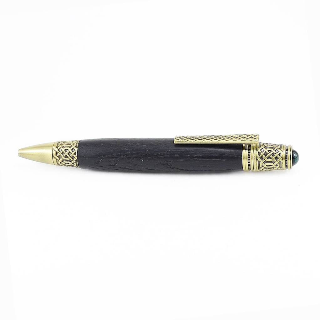 Celtic Knot Irish Bog Oak ballpoint pen with antique brass trim and emerald cabochon
