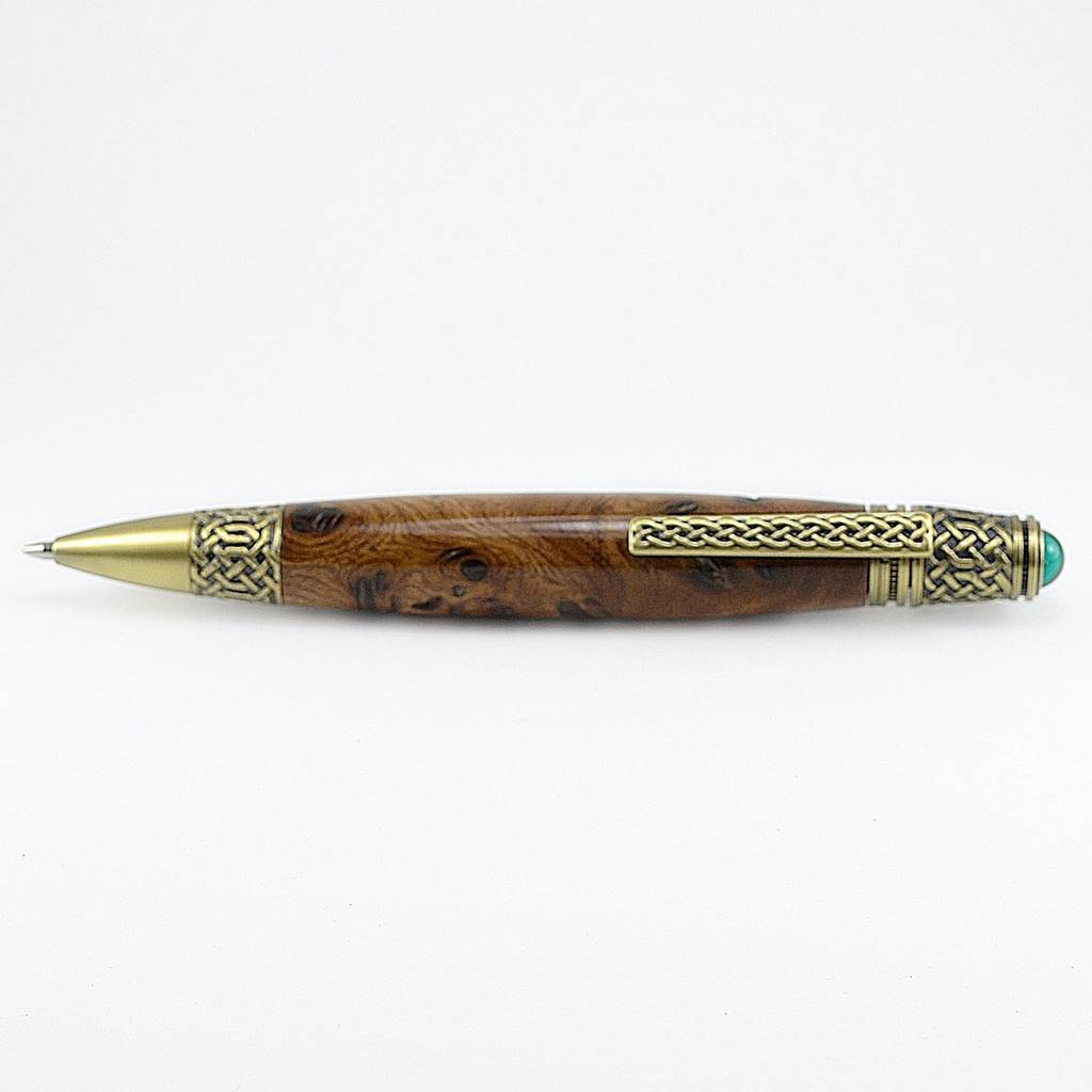 Handcrafted Celtic Knot pen made from rare Burled Irish Elm with antique brass detailing and emerald cabochon – presented in a luxury Irish pen case