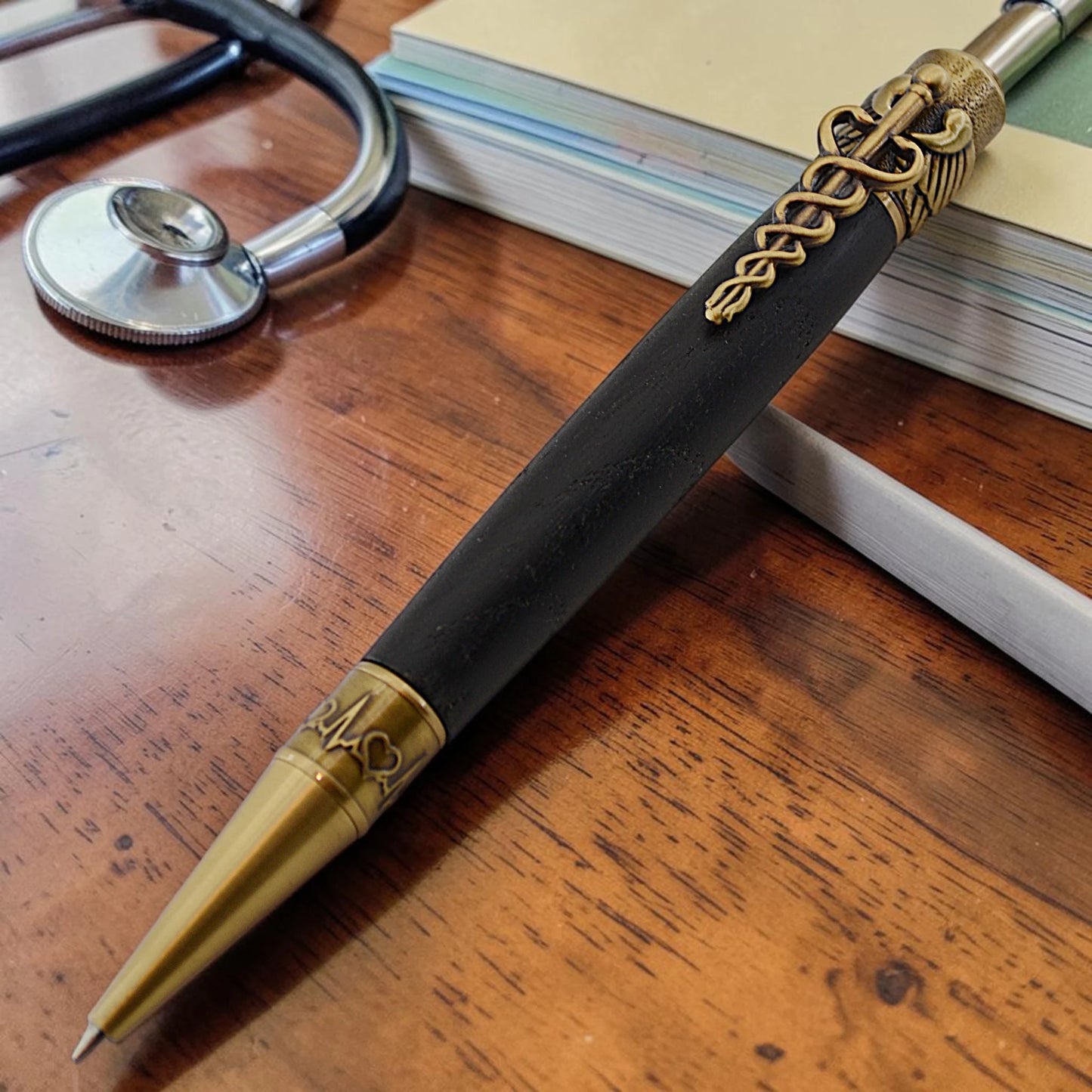 Cura Medical Pen in Irish Bog Oak with antique brass medical caduceus clip