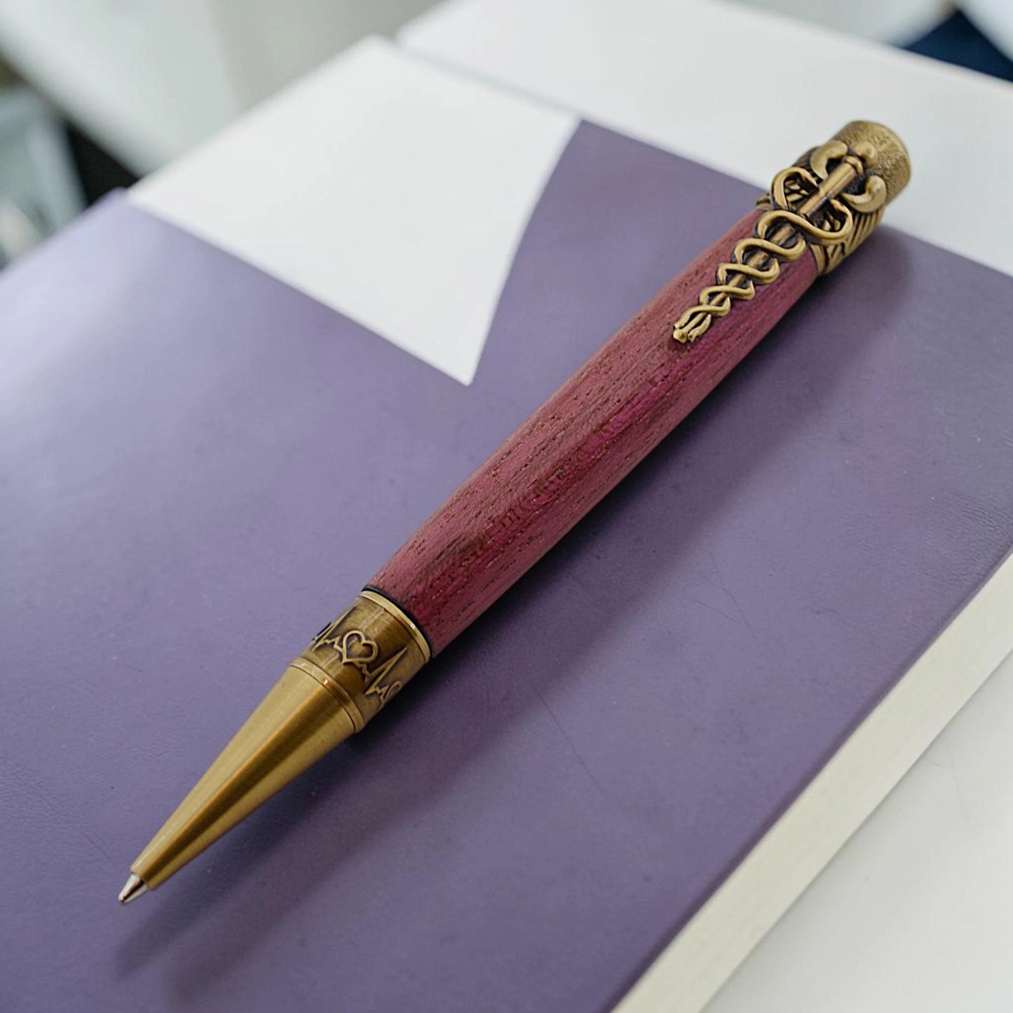 Cura Medical Pen in Purpleheart wood with antique brass caduceus clip