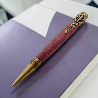 Cura Medical Pen in Purpleheart wood with antique brass caduceus clip