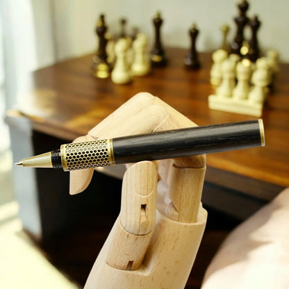 Handmade rollerball pen crafted in Ireland from ancient Irish bog oak, showcasing rich dark grain and traditional craftsmanship.