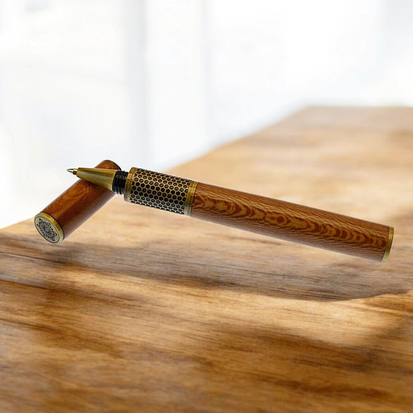 Handmade Hive Rollerball Pen crafted from English Plane wood with antique brass trim

