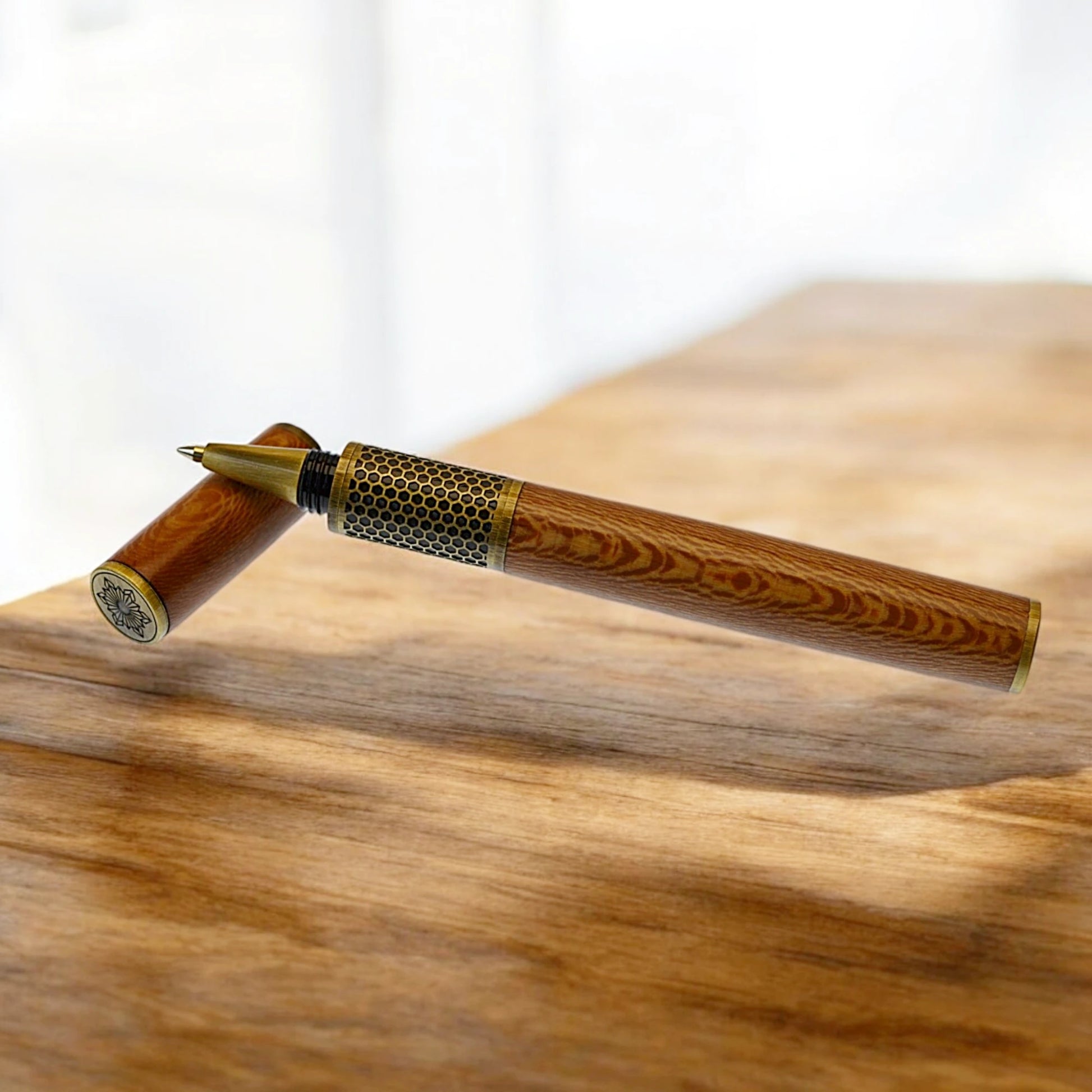 Handmade Hive Rollerball Pen crafted from English Plane wood with antique brass trim

