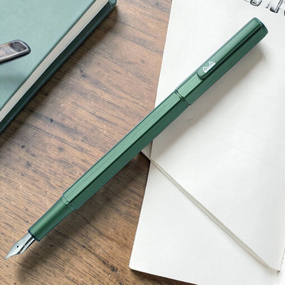 Rhodia ScRipt fountain pen in orange and sage green aluminium body on wooden desk – fast dispatch Ireland