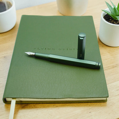 Rhodia ScRipt fountain pen in orange and sage green aluminium body on wooden desk – fast dispatch Ireland